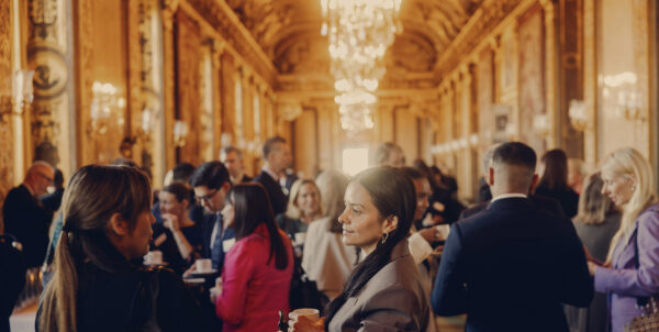 Delegates networking in the Stockholm Royal Palace during a Forum event.